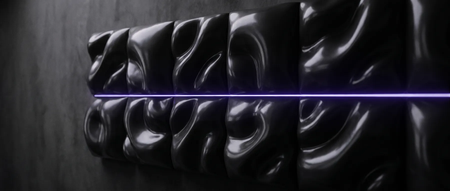 A dark wall of fine seams, lit along one edge by low purple light.